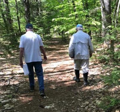 Ed Gervais and RRCT Board Member Rob Wood walked the neighborhood trails this spring, in the early stages of the project, discussing a donation